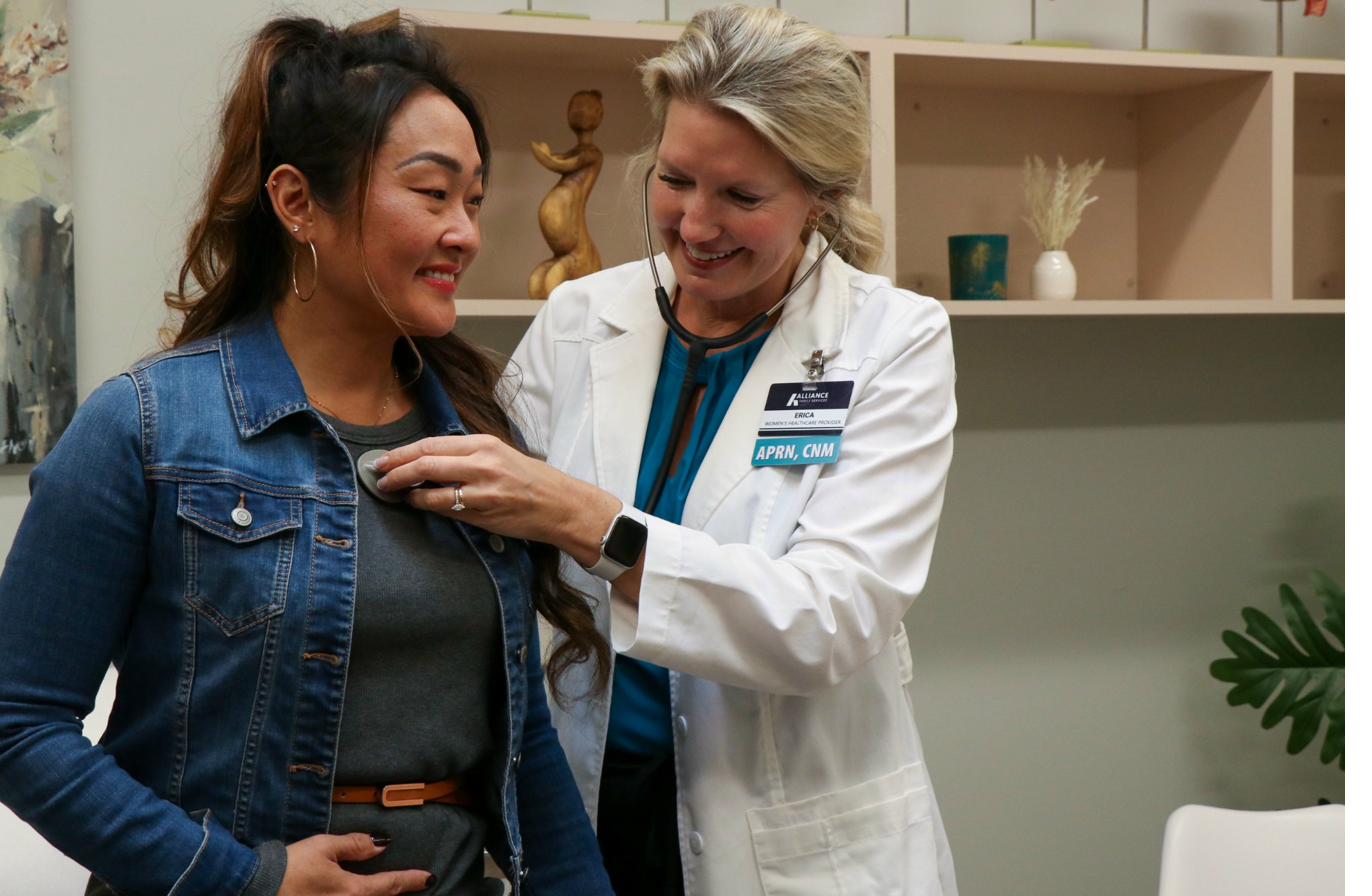 Licensed provider performing an examination at Alliance Women's Clinic