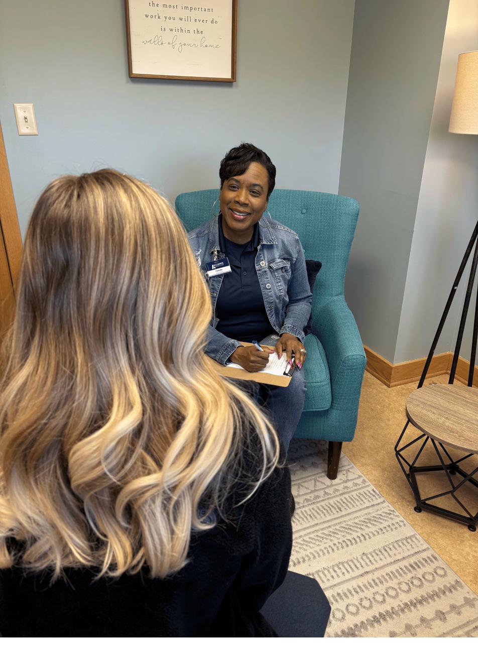 Case manager consulting with a patient in a warm, welcoming setting